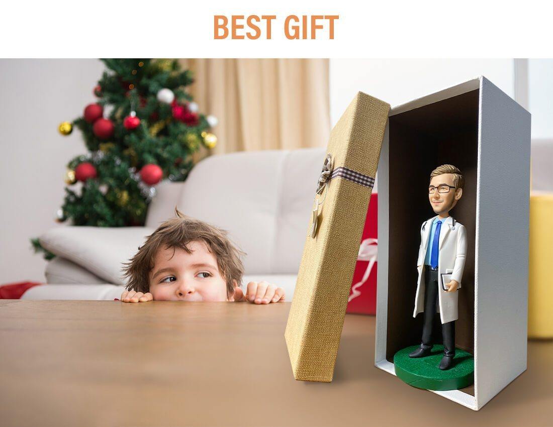 Custom doctor bobblehead in gift box on table, child peeking, Christmas tree in background