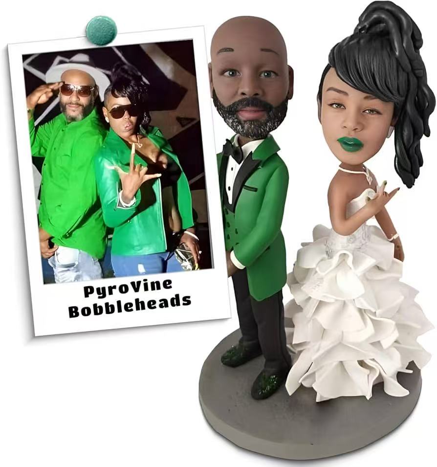 The bride's wedding dress, the groom's suit, and custom-engraved Valentine's Day bobblehead dolls.