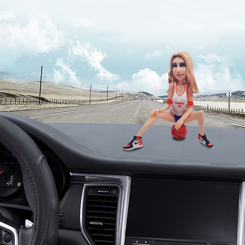 Car-mounted custom bobblehead doll of woman sitting on basketball